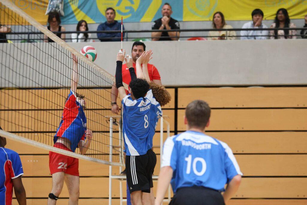 male volleyball players play