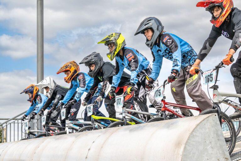 6 BMX riders at start gate