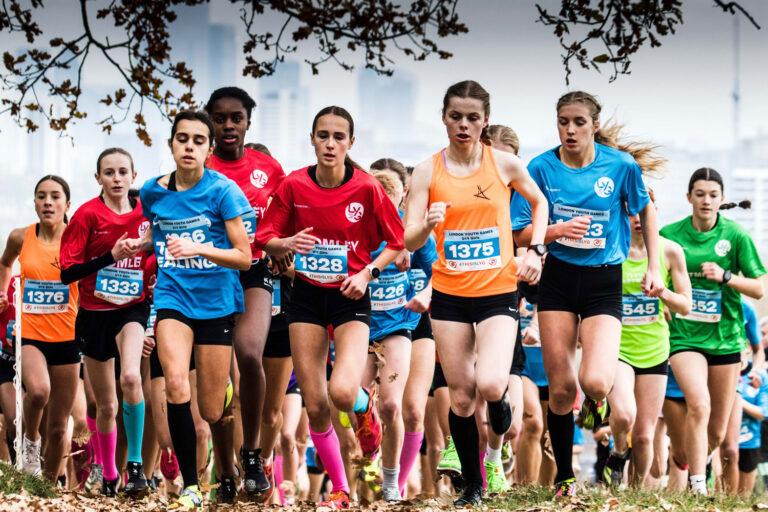 mixed ethnicity females run in cross country