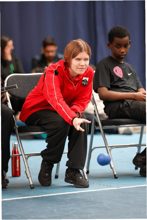 White female Amelie plays boccia